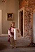 Boucle Letter cushion B by Bettys Home Teddy Letter Pillow held by little boy in red stripe blouse