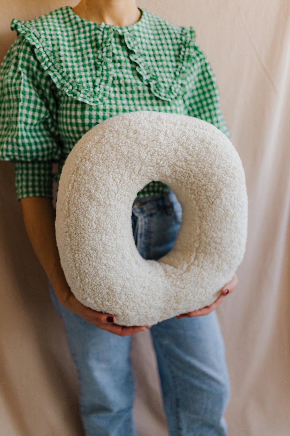 boucle letter cushion O teddy pillow by bettys home held by woman in green shirt birthday gift idea