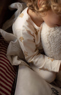 little boy hugging boucle pillow by bettys home kids room deco idea