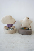 kids sitting on boucle floor poufs by bettys home with boucle cloud cushion and boucle star cushion in their hands