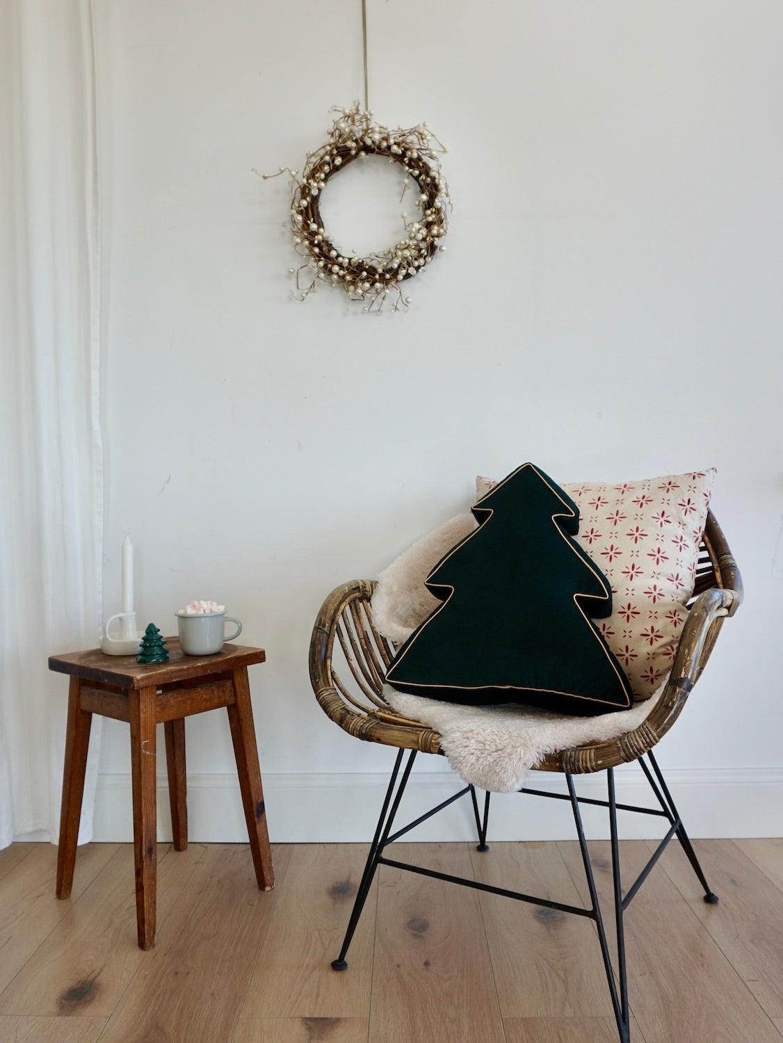 Christmas Tree Cushion Green by Bettys Home on chair in living room during xmas time