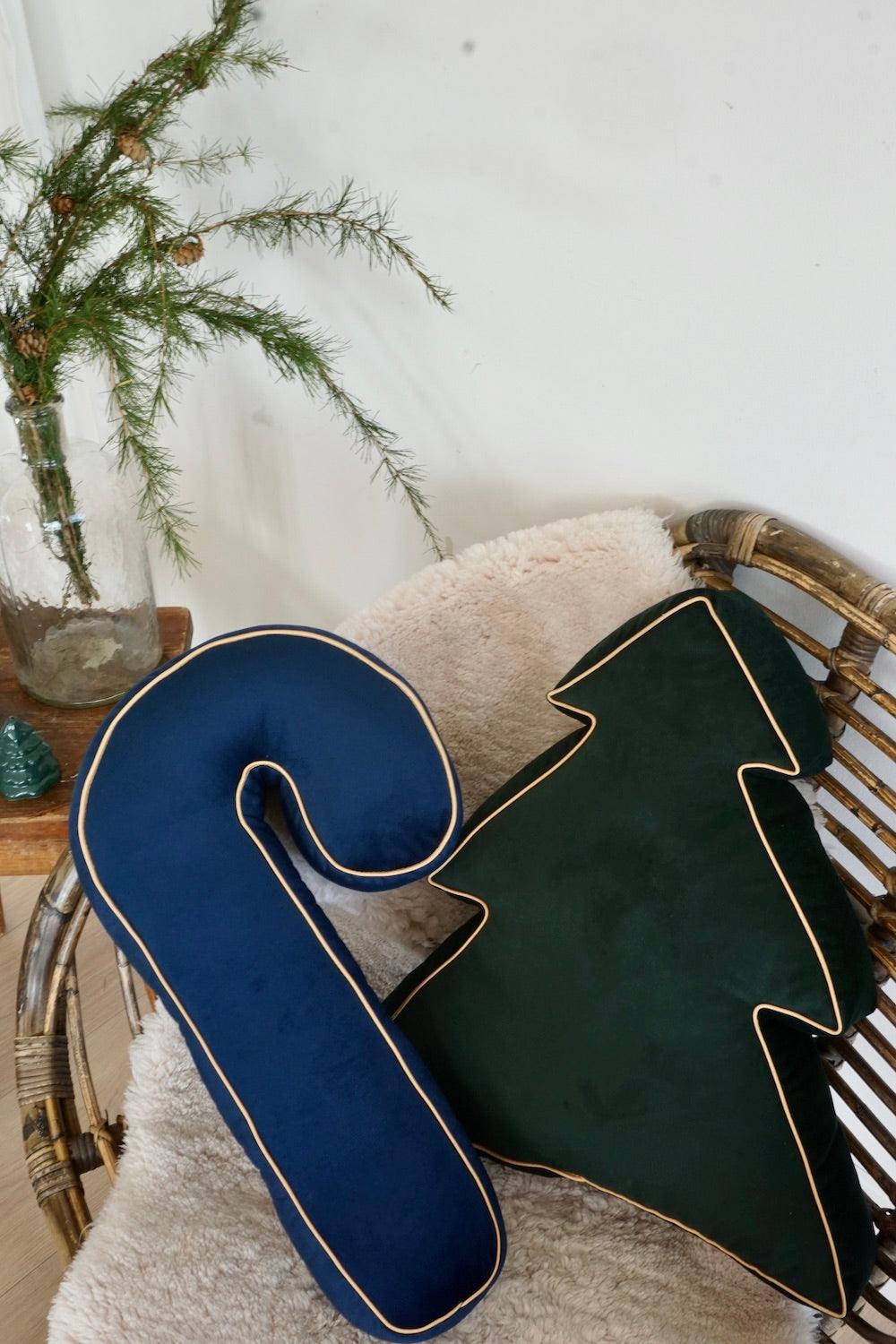 Christmas tree cushion in green velvet by Bettys Home on chair with christmas candy cane cushion
