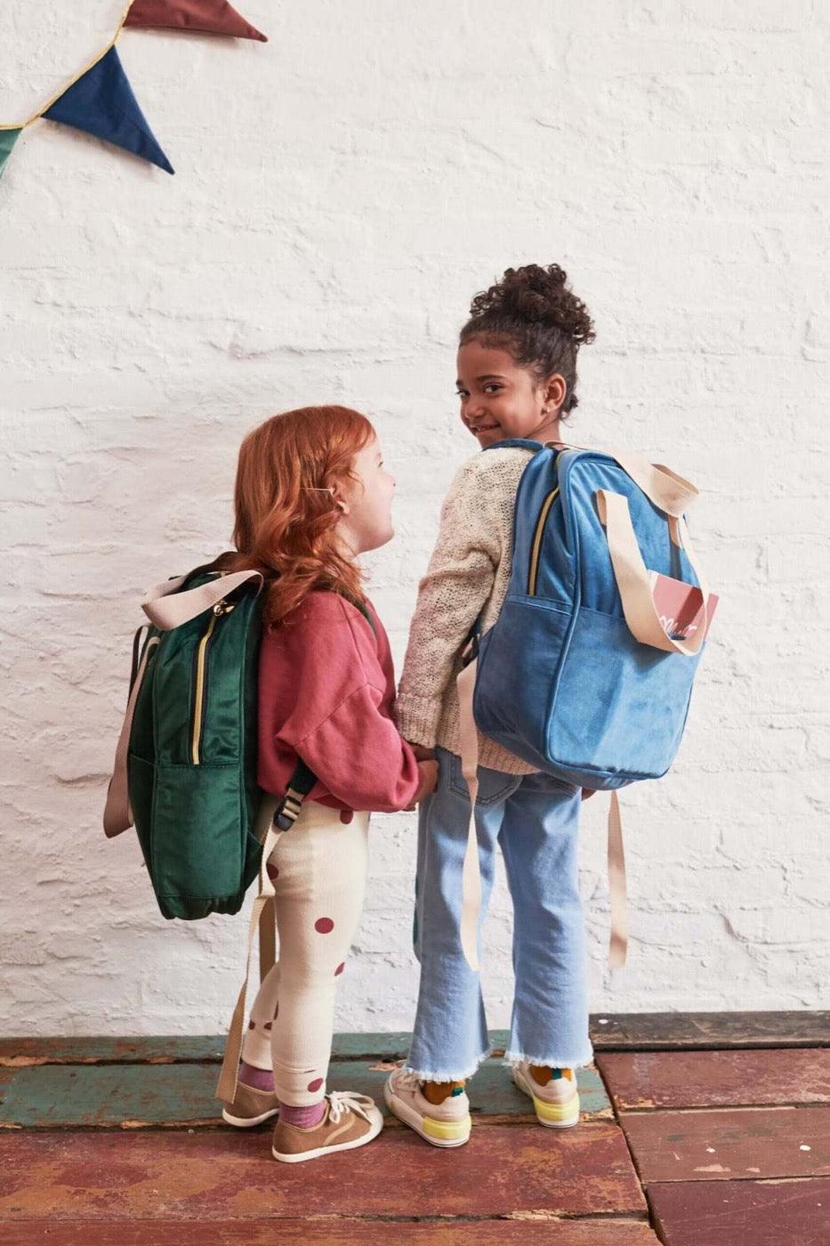 two girls in kindergarten with velvet backpack. school backpack for girls. small backpack for kindergarten