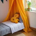 Velvet Letter Cushion & by Bettys Home on kids bed under beautiful yellow canopy and garland. Birthday present ideas for her