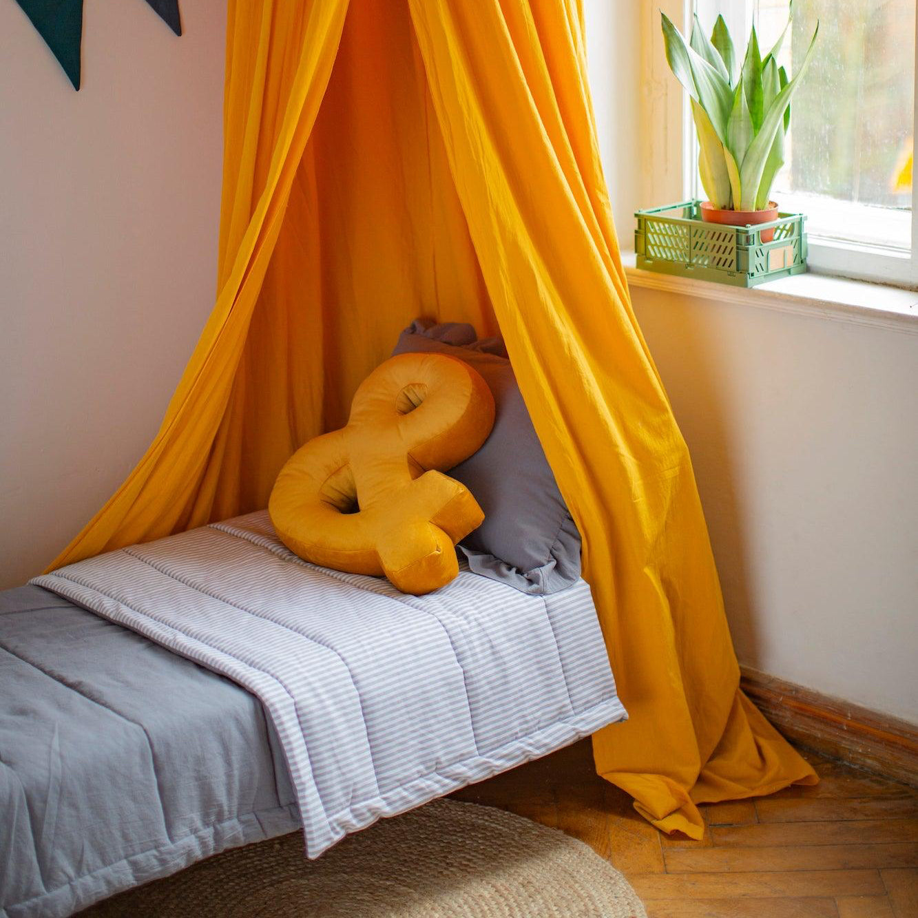 Velvet Letter Cushion & by Bettys Home on kids bed under beautiful yellow canopy and garland. Birthday present ideas for her
