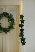 velvet star garland green by bettys home hanging on the door as a Christmas decoration for every home