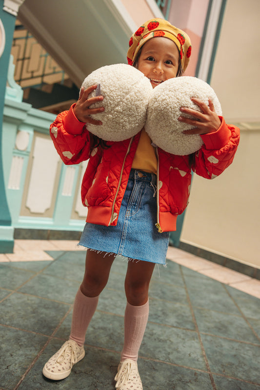 girl in school with boucle ball cushions by bettys home. Ball shaped cushion. Boucle Ball Pillow