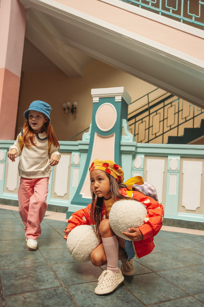girls in school with boucle ball cushions by bettys home. Ball shaped cushion. Boucle Ball Pillow