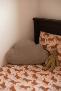 boucle cloud cushion mocha on kids bed. teddy pillow