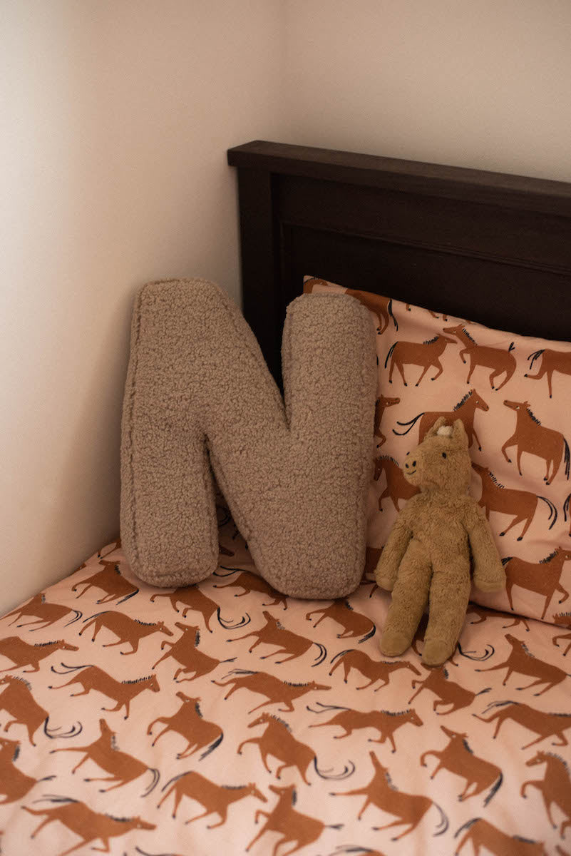 boucle letter cushion n by bettys home on kids bed. teddy pillow