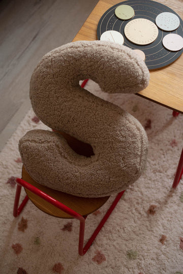 boucle letter cushion S mocha by bettys home on kids chair. Alphabet pillow