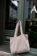 boucle shopper bag mocha by bettys home hanging on shop door. Boucle tote bag