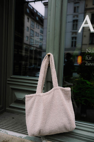 boucle shopper bag mocha by bettys home hanging on shop door. Boucle tote bag