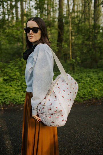 cherry tote bag by Bettys home with woman in woods 
