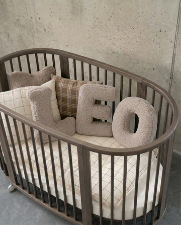 Boucle Letter Cushion LEO in kids crib. Letter Cushion by Bettys Home