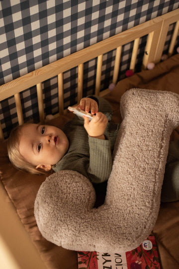 little kid with boucle letter cushion by Bettys home 