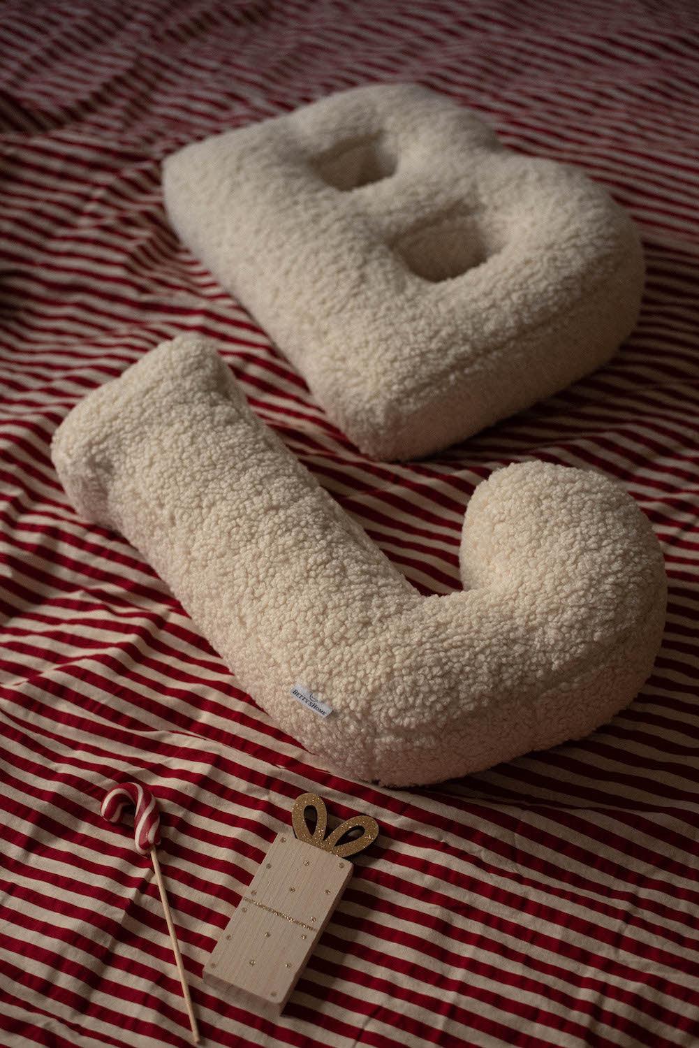 Boucle Letter cushion J and B  by Bettys Home Teddy Letter Pillow lying on bed in bedroom as bed deco idea