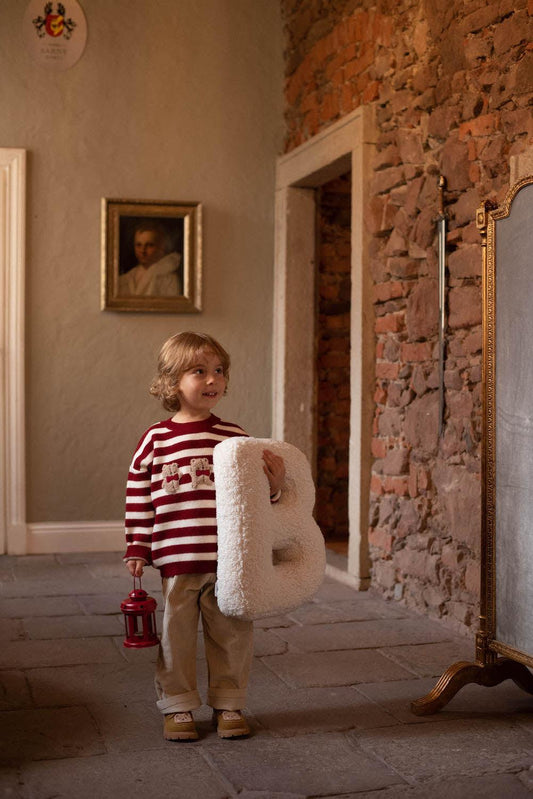 Boucle Letter cushion B by Bettys Home Teddy Letter Pillow held by cute boy in red stripe blouse