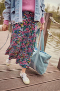 Young girl after her work with blue corduroy shopper bag by bettys home