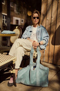 A girl during her free time siting in restaurant with corduroy blue tote bag by bettys home