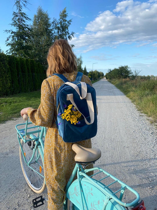 woman during her trip on a bike with velvet backpack by bettys home. ladies backpack for work 