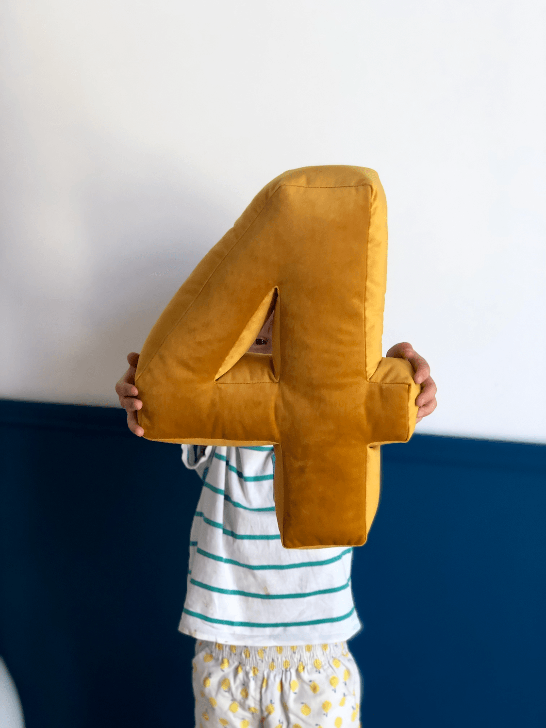 little boy holding velvet number 4 in yellow. birthday deco idea by bettys home 2