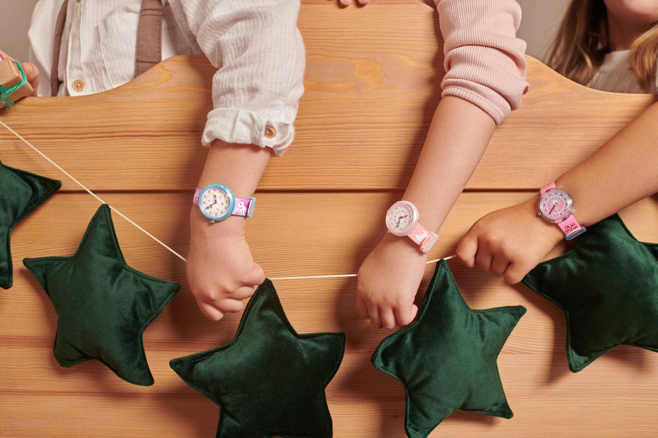 velvet star garland green by bettys home which is held by small kids in their hands