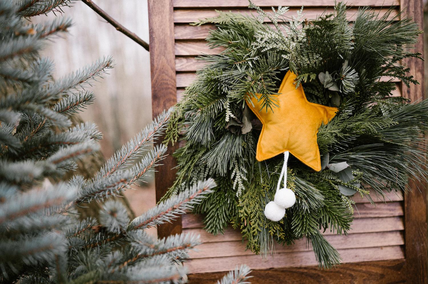 velvet little star pendant yellow with pompoms by bettys home hanging on festive reed