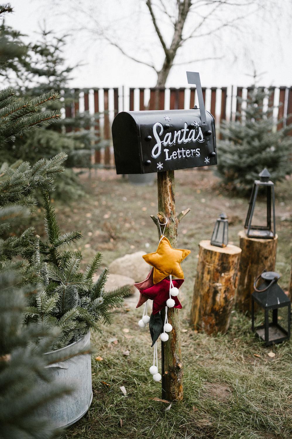 velvet little star pendant yellow with pompoms by bettys home hanging on old fashion mail box as christmas decoration