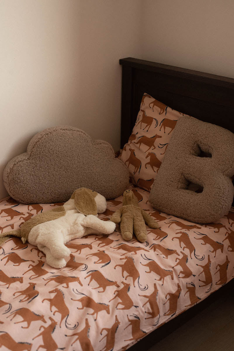 boucle letter cushion B and boucle cloud cushion on bed as kids room deco idea