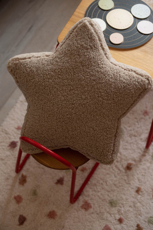 boucle star cushion mocha on kids chair. teddy star pillow 