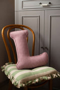 corduroy letter cushion L by bettys home in kids room on chair. Cushion in shape of letter