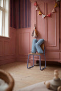 corduroy letter cushion K by bettys home in kids room on chair. Cushion in shape of letter