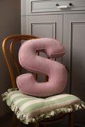 corduroy letter cushion S by bettys home in kids room on chair. Cushion in shape of letter