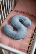 corduroy letter cushion S by bettys home in kids room on mattress. Cushion in shape of letter
