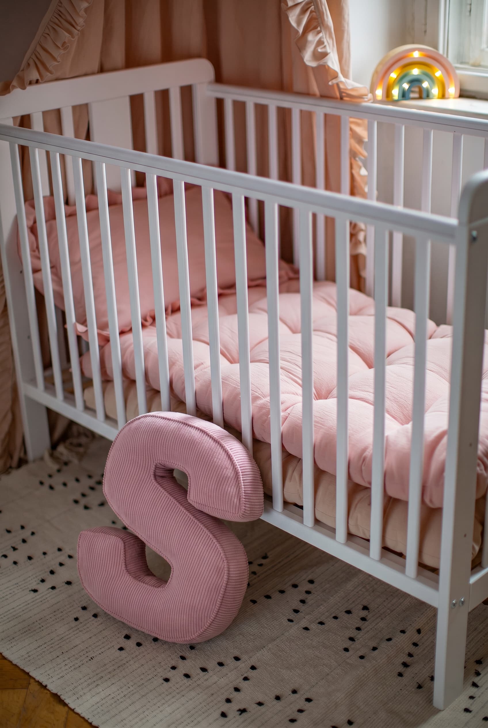 corduroy letter cushion S by bettys home in kids room on floor. Cushion in shape of letter