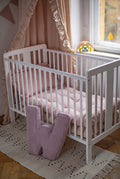 corduroy letter cushion W by bettys home in kids room on floor next to crib. Cushion in shape of letter