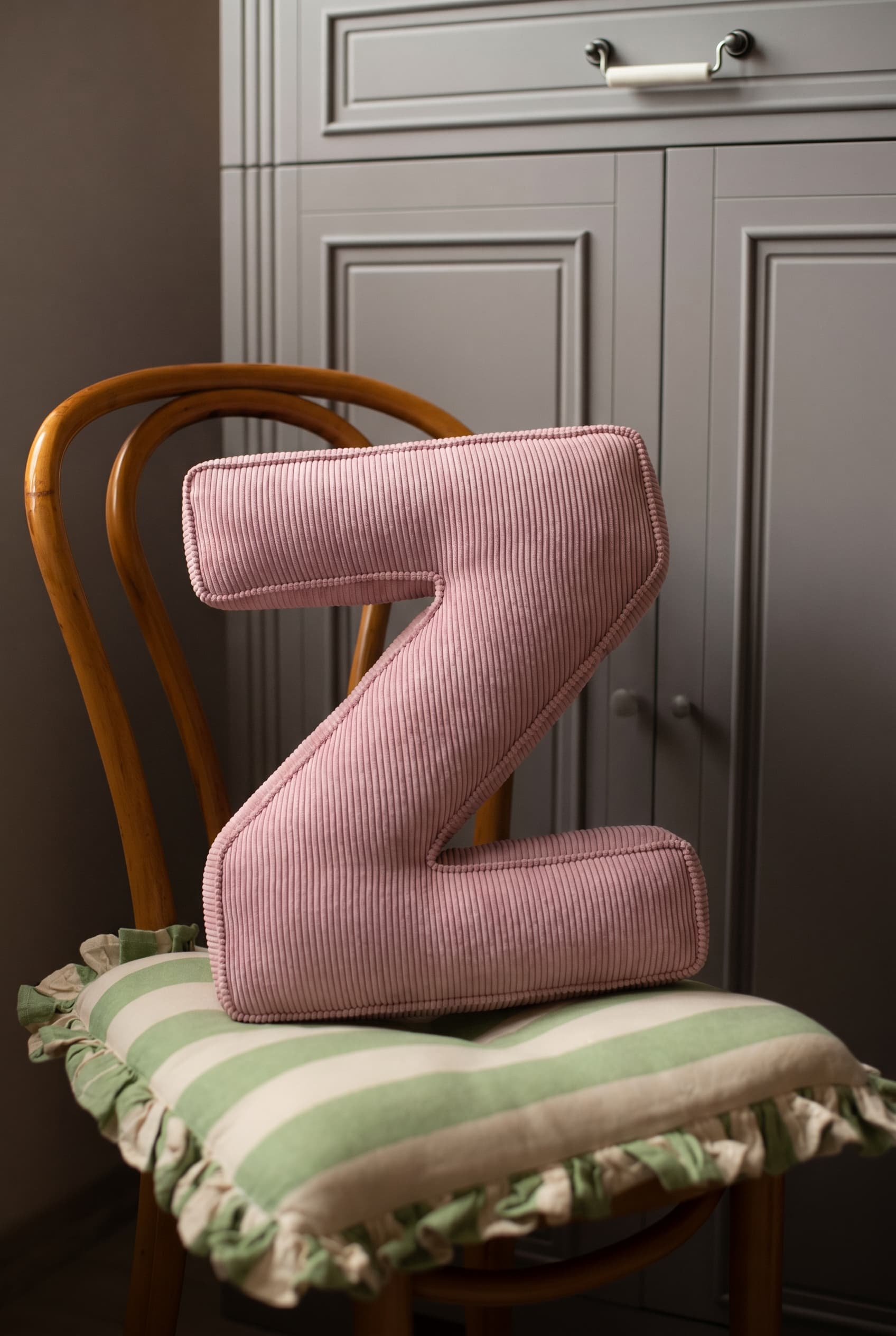 corduroy letter cushion Z by bettys home in kids room on chair. Cushion in shape of letter