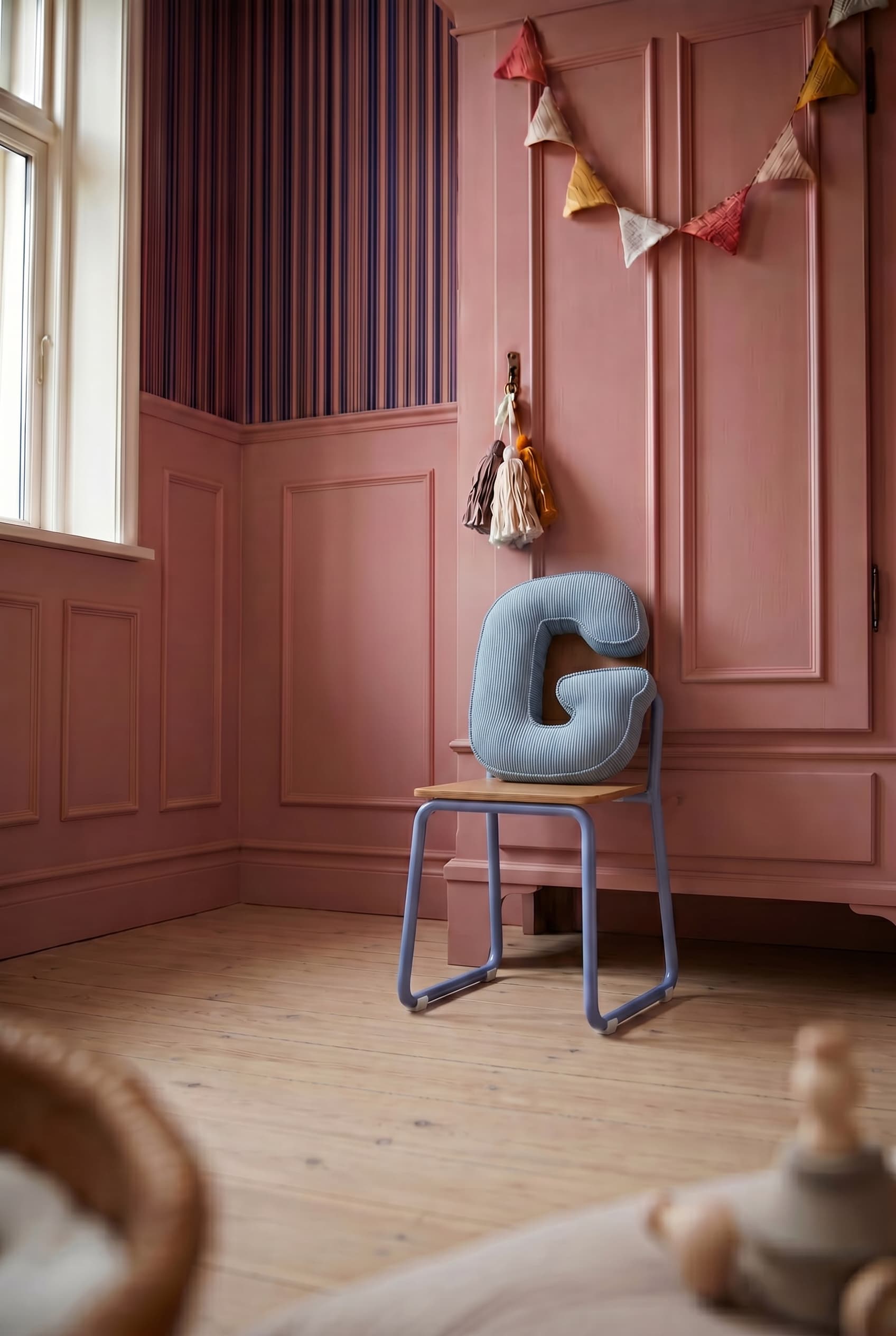 corduroy letter cushion g by bettys home in kids room on chair and pink wall 