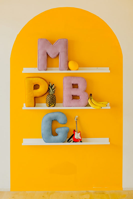 corduroy letter cushion B M P G by bettys home in kids room. Cushion in shape of letter A on shelf