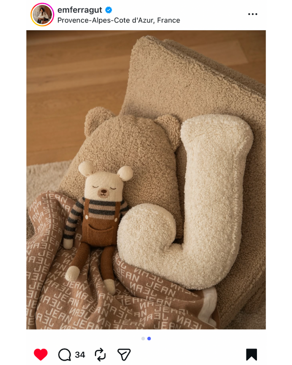 boucle letter cushion by Bettys home on chair 