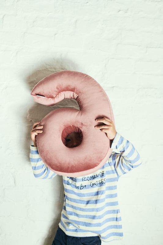 velvet number cushion 6 by bettys home hold by little boy. Cushion in shape of number