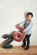 velvet number cushion by bettys home. number shaped cushion by bettys home hold by a boy