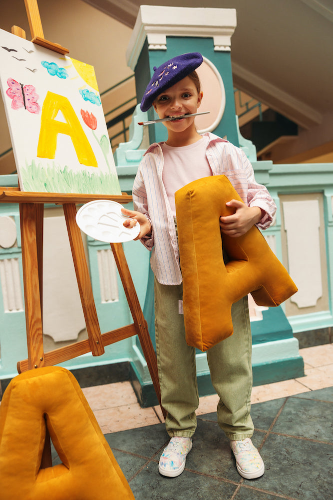 girl in school painting velvet letter cushion A by bettys home. letter pillow in velvet 