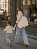 woman in city with daughter and Lemon Ruffle Tote Bag by Bettys home 